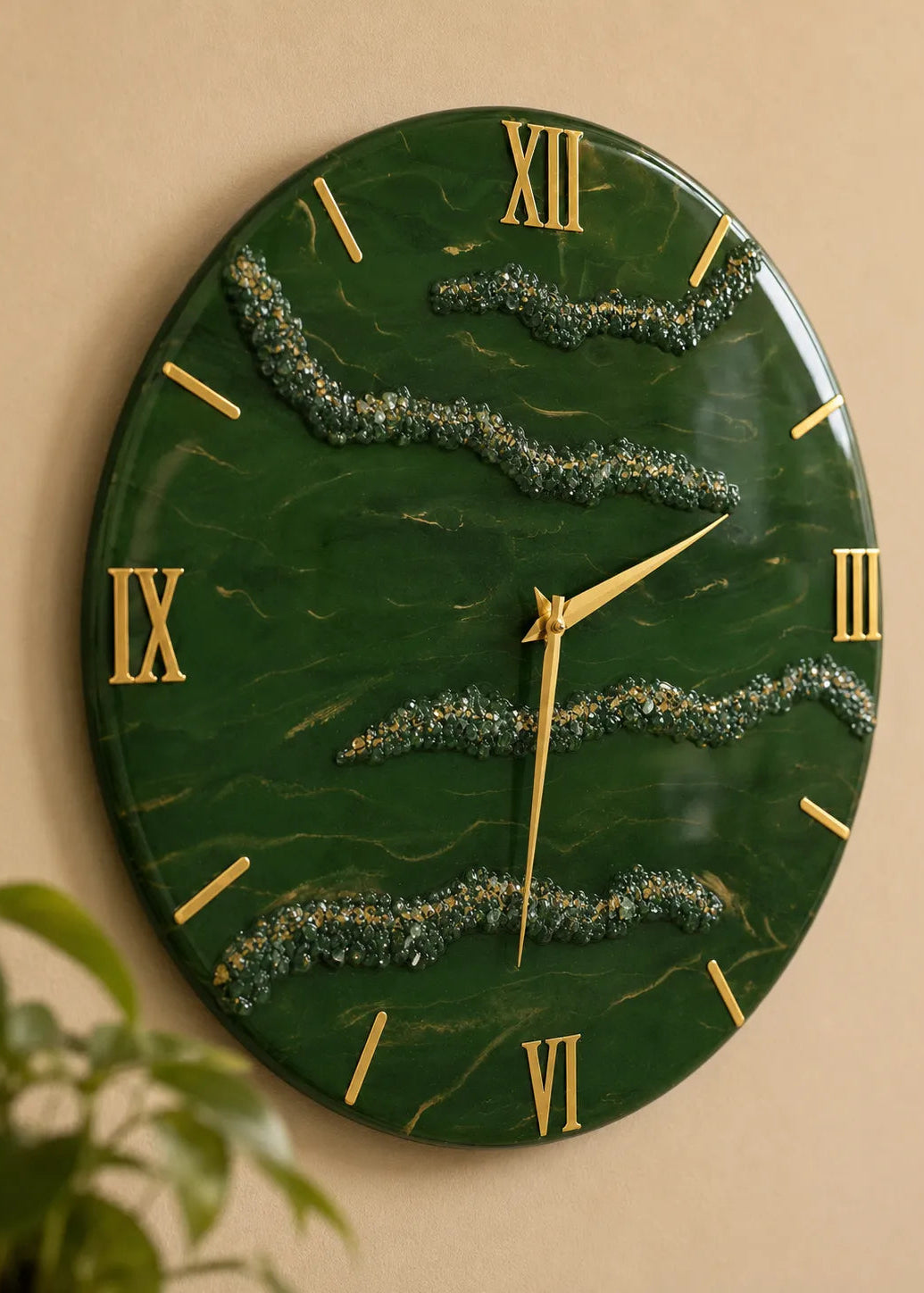 Green marble-style wall clock with gold Roman numerals on a beige wall.