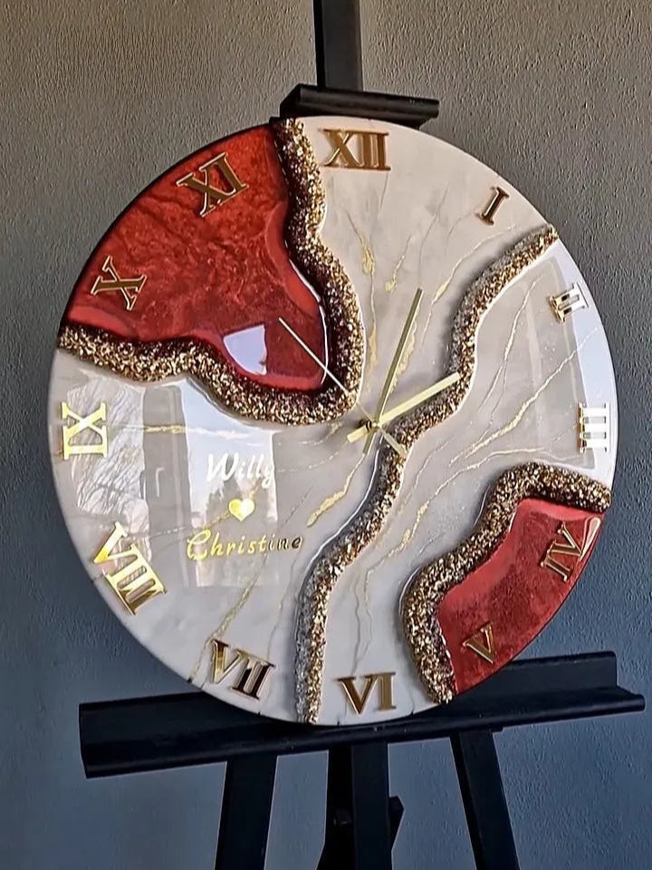 Decorative clock with Roman numerals on a stand against a gray background