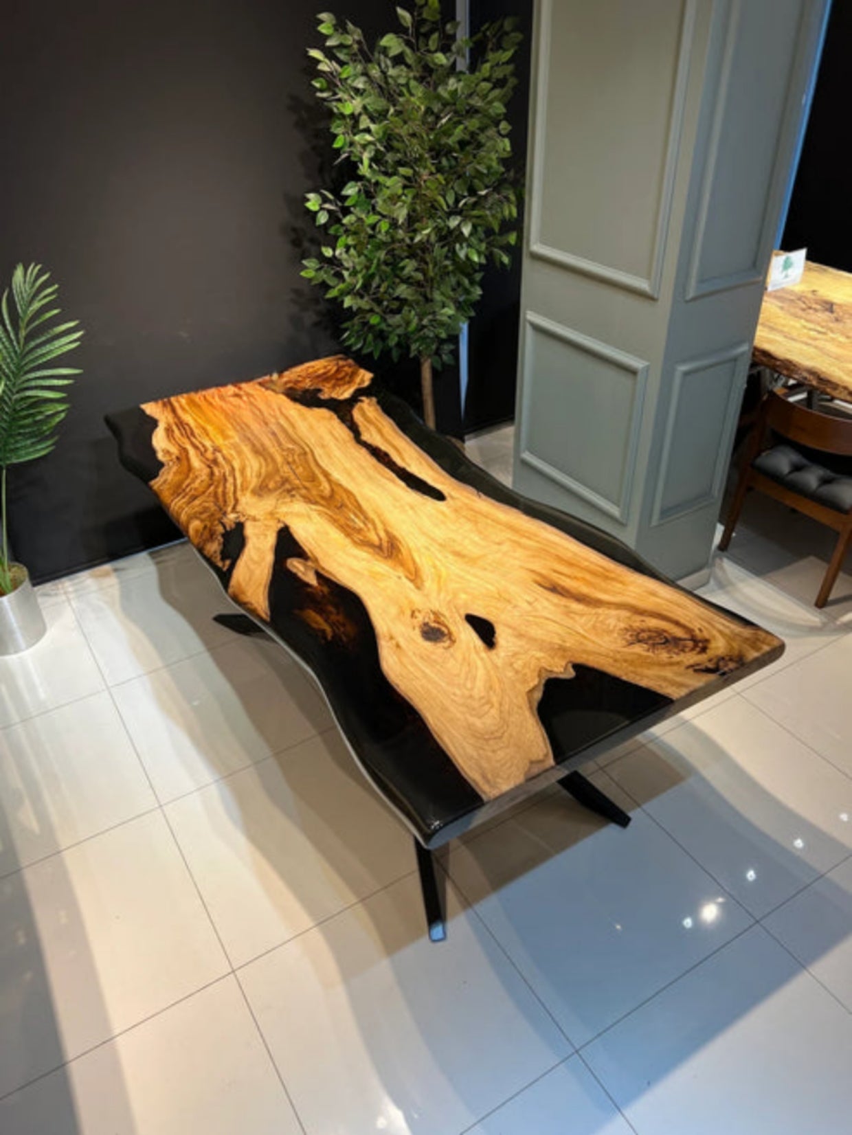 Black epoxy resin dining table in the living room